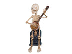 squelette assis avec banjo motoris sonore et lumineux 90cm